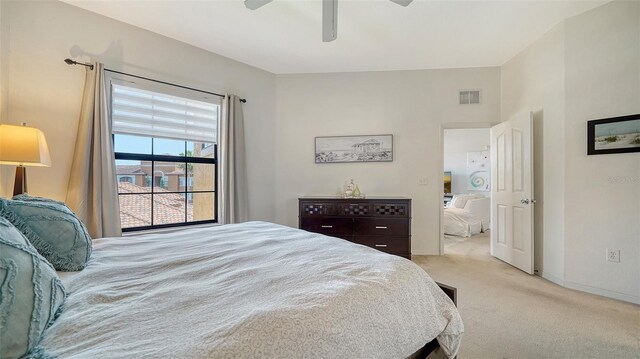 8397 38th Street Cir E Unit 306, Sarasota, FL 34243 - carpeted bedroom with baseboards and ceiling fan