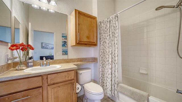 8397 38th Street Cir E Unit 306, Sarasota, FL 34243 - bathroom featuring vanity, shower / bath combo, and tile patterned flooring