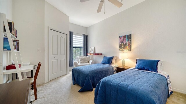 8397 38th Street Cir E Unit 306, Sarasota, FL 34243 - bedroom featuring light carpet, ceiling fan, and a closet