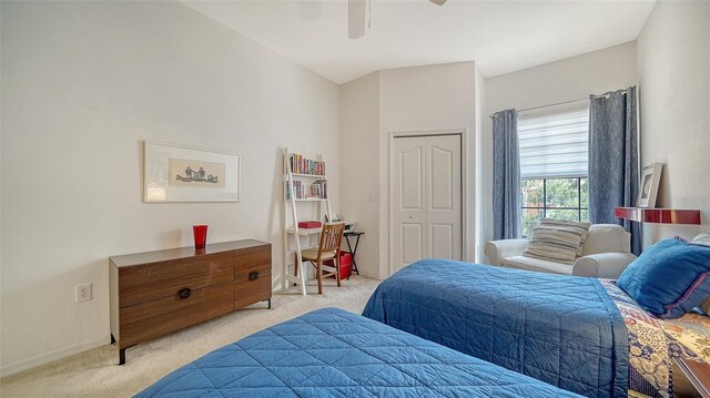 8397 38th Street Cir E Unit 306, Sarasota, FL 34243 - bedroom featuring light colored carpet, ceiling fan, and a closet
