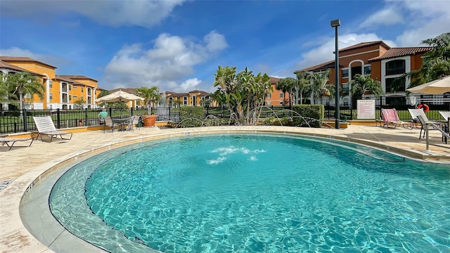 8397 38th Street Cir E Unit 306, Sarasota, FL 34243 - community pool featuring a residential view and a patio area