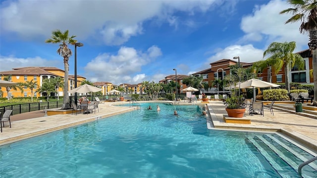 8397 38th Street Cir E Unit 306, Sarasota, FL 34243 - community pool featuring a residential view and a patio area