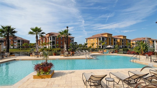 8397 38th Street Cir E Unit 306, Sarasota, FL 34243 - community pool featuring a patio area and a residential view