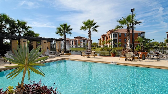 8397 38th Street Cir E Unit 306, Sarasota, FL 34243 - community pool with a pergola and a patio area