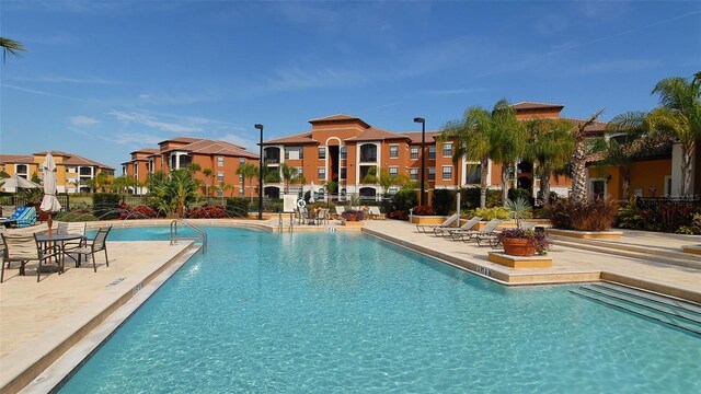 8397 38th Street Cir E Unit 306, Sarasota, FL 34243 - community pool with a residential view and a patio