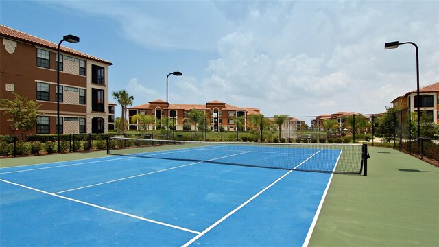 8397 38th Street Cir E Unit 306, Sarasota, FL 34243 - view of tennis court featuring a residential view