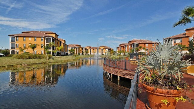 8397 38th Street Cir E Unit 306, Sarasota, FL 34243 - dock featuring a residential view and a water view