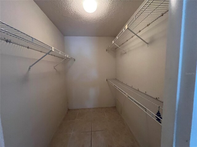 3231 Beneva Rd Unit 202, Sarasota, FL 34232 - spacious closet with light tile patterned flooring