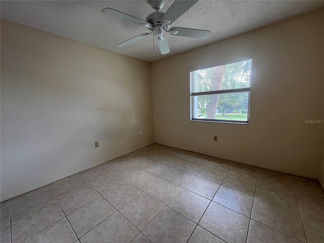 3231 Beneva Rd Unit 202, Sarasota, FL 34232 - empty room featuring light tile patterned flooring and a ceiling fan