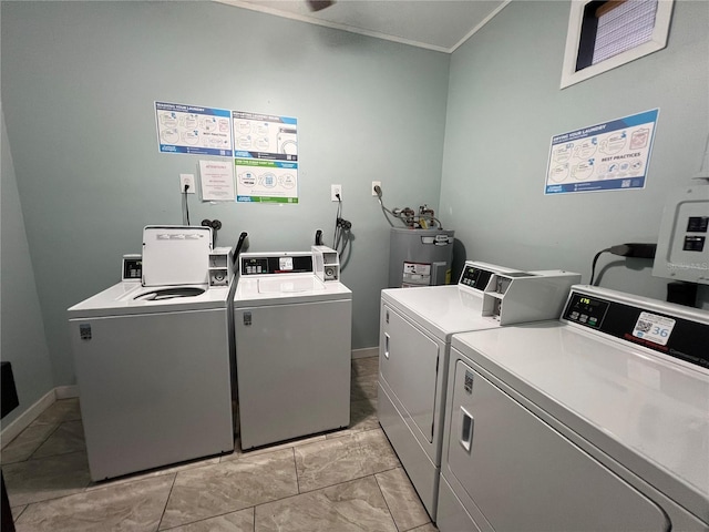 3231 Beneva Rd Unit 202, Sarasota, FL 34232 - community laundry room featuring separate washer and dryer, crown molding, and water heater