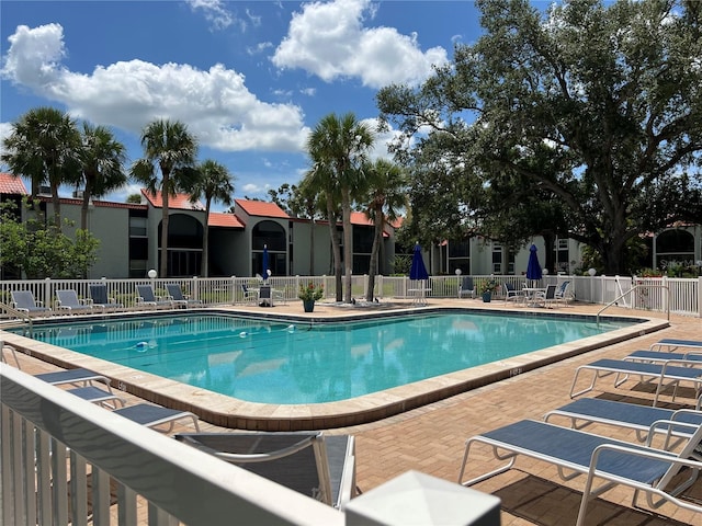 3231 Beneva Rd Unit 202, Sarasota, FL 34232 - community pool featuring a patio area