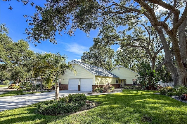 6818 Arbor Oaks Cir, Bradenton, FL 34209 - view of front of home featuring driveway, a garage, and brick siding