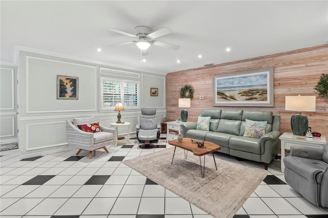 6818 Arbor Oaks Cir, Bradenton, FL 34209 - living room featuring a ceiling fan, wood walls, light tile patterned floors, and recessed lighting