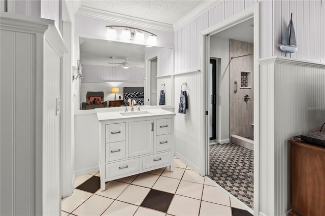 6818 Arbor Oaks Cir, Bradenton, FL 34209 - bathroom featuring vanity, a tile shower, crown molding, ceiling fan, and a textured ceiling