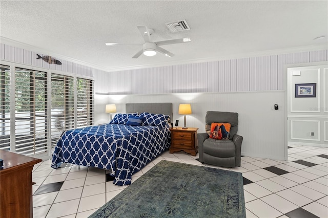 6818 Arbor Oaks Cir, Bradenton, FL 34209 - bedroom with ornamental molding, tile patterned flooring, ceiling fan, and a textured ceiling