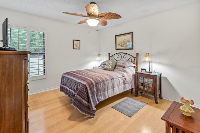 6818 Arbor Oaks Cir, Bradenton, FL 34209 - bedroom with light wood-style flooring and a ceiling fan