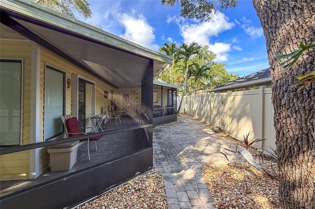 6818 Arbor Oaks Cir, Bradenton, FL 34209 - view of patio with a sunroom