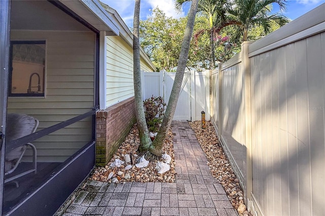 6818 Arbor Oaks Cir, Bradenton, FL 34209 - view of home's exterior featuring brick siding and a fenced backyard