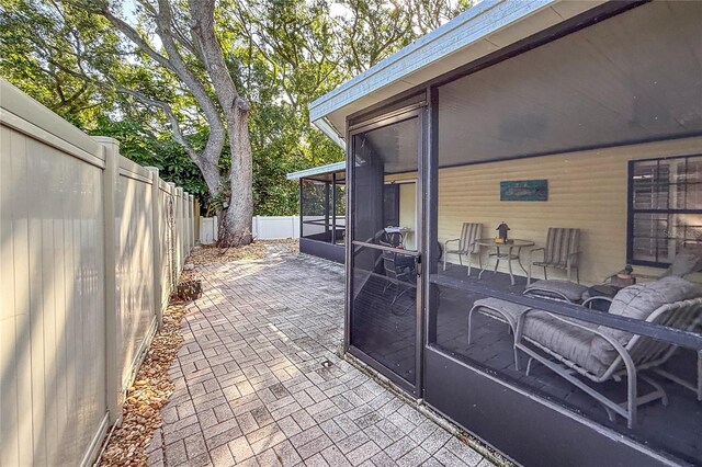 6818 Arbor Oaks Cir, Bradenton, FL 34209 - fenced backyard featuring a sunroom and a patio