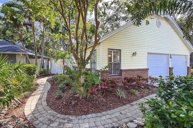 6818 Arbor Oaks Cir, Bradenton, FL 34209 - view of home's exterior featuring brick siding and a garage