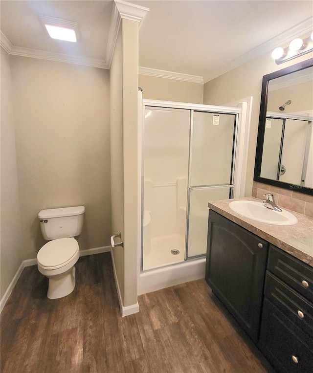 1106 49th Avenue Dr W, Bradenton, FL 34207 - full bathroom featuring wood finished floors, a stall shower, vanity, and ornamental molding