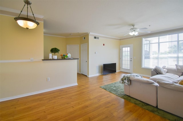 4802 51st St W Unit 1310, Bradenton, FL 34210 - living room featuring ceiling fan, light wood-type flooring, and ornamental molding