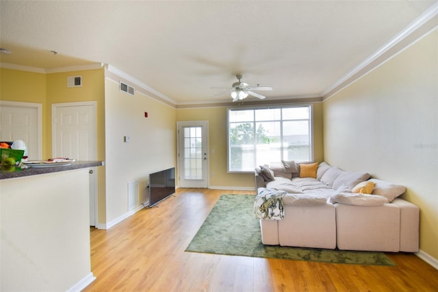 4802 51st St W Unit 1310, Bradenton, FL 34210 - living room featuring ornamental molding, ceiling fan, and light wood-style floors