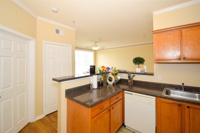 4802 51st St W Unit 1310, Bradenton, FL 34210 - kitchen with dishwasher, a peninsula, ornamental molding, a ceiling fan, and light wood-style flooring