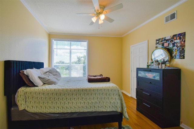 4802 51st St W Unit 1310, Bradenton, FL 34210 - bedroom featuring ornamental molding, wood finished floors, and ceiling fan