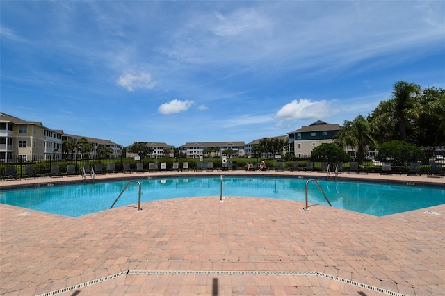 4802 51st St W Unit 1310, Bradenton, FL 34210 - community pool featuring a residential view and a patio area
