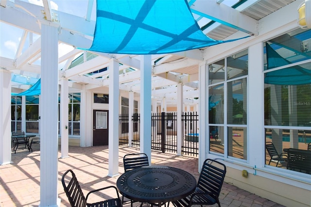 4802 51st St W Unit 1310, Bradenton, FL 34210 - view of patio / terrace with a pergola and outdoor dining area