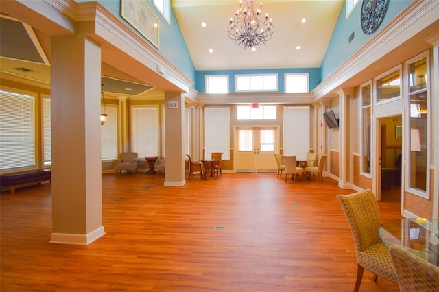 4802 51st St W Unit 1310, Bradenton, FL 34210 - entrance foyer with high vaulted ceiling, a chandelier, wood finished floors, and french doors
