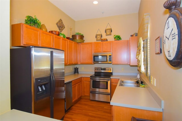 4802 51st St W Unit 1310, Bradenton, FL 34210 - kitchen with appliances with stainless steel finishes, light wood-type flooring, light countertops, and recessed lighting