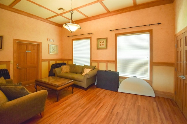 4802 51st St W Unit 1310, Bradenton, FL 34210 - living area with light wood-type flooring, healthy amount of natural light, wainscoting, ornamental molding, and a high ceiling