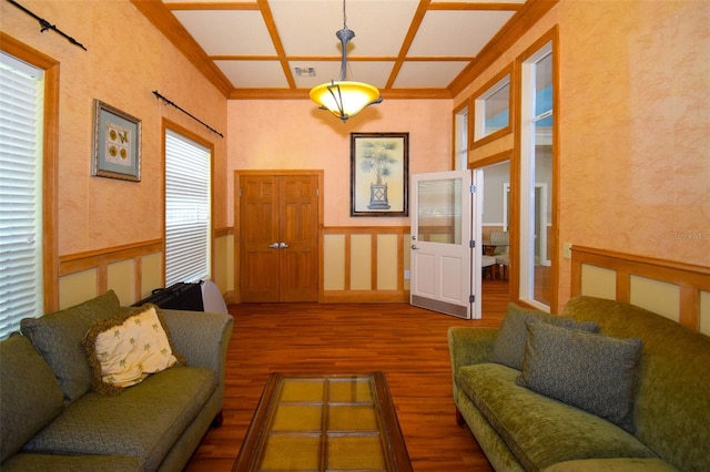 4802 51st St W Unit 1310, Bradenton, FL 34210 - living area featuring wood finished floors, coffered ceiling, wainscoting, crown molding, and a decorative wall