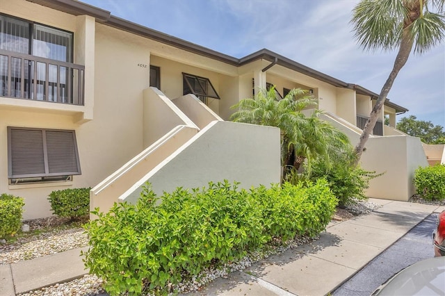 4658 Longwater Chase Unit 104, Sarasota, FL 34235 - view of side of home with stucco siding