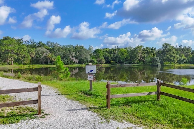 4658 Longwater Chase Unit 104, Sarasota, FL 34235 - view of street featuring a water view and a wooded view