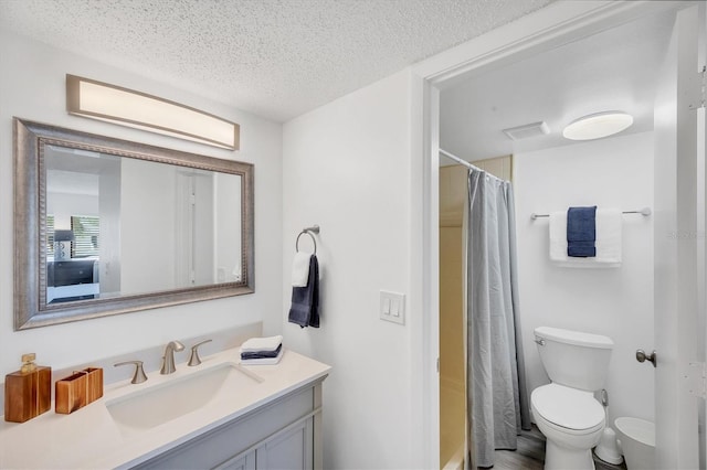 4658 Longwater Chase Unit 104, Sarasota, FL 34235 - bathroom with vanity, a textured ceiling, and shower / bath combo with shower curtain