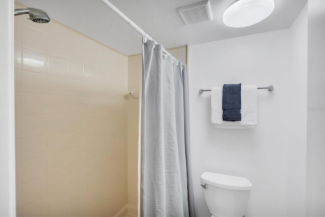 4658 Longwater Chase Unit 104, Sarasota, FL 34235 - bathroom featuring a tile shower and toilet