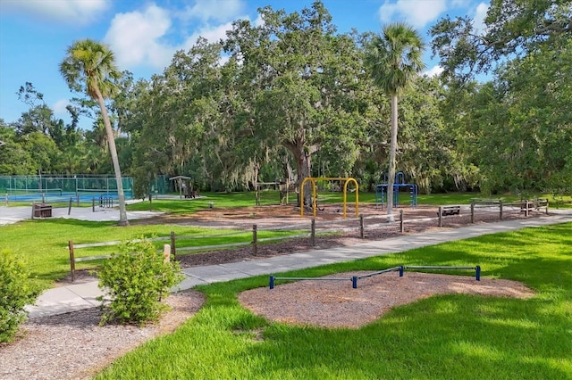 4658 Longwater Chase Unit 104, Sarasota, FL 34235 - view of property's community featuring a tennis court and view of scattered trees