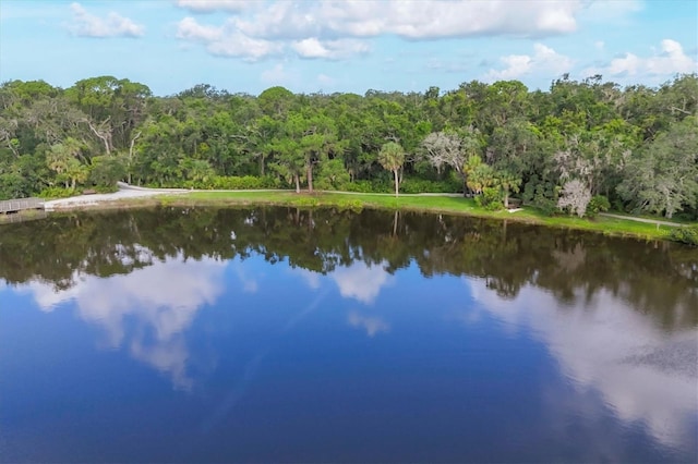 4658 Longwater Chase Unit 104, Sarasota, FL 34235 - water view featuring a forest