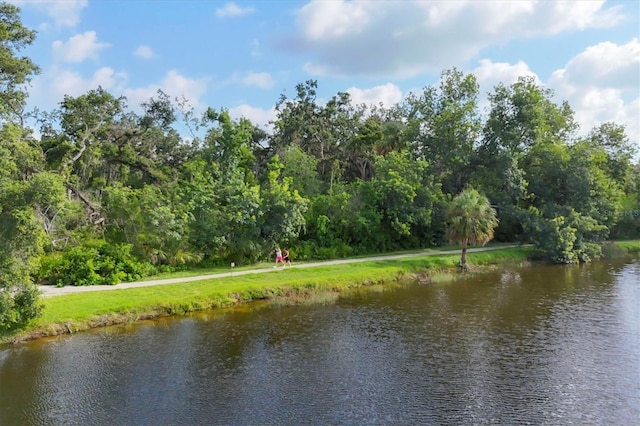 4658 Longwater Chase Unit 104, Sarasota, FL 34235 - water view featuring a forest
