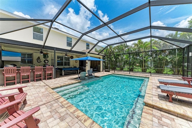 3911 91st Ave E, Parrish, FL 34219 - outdoor pool featuring a patio area, ceiling fan, and glass enclosure