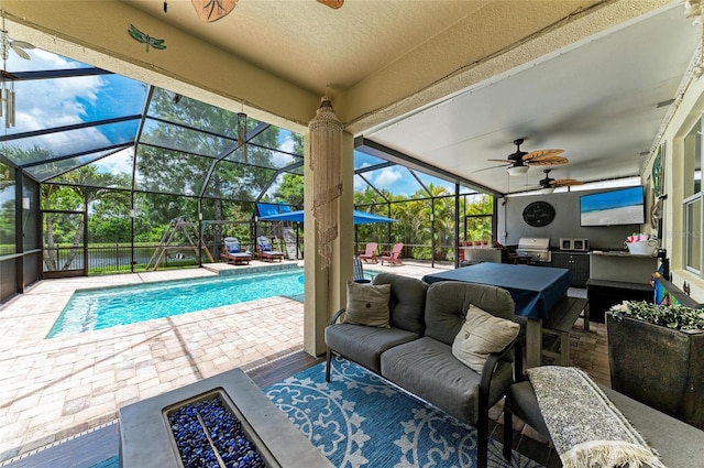 3911 91st Ave E, Parrish, FL 34219 - view of patio with a grill, ceiling fan, an outdoor hangout area, an outdoor pool, and glass enclosure