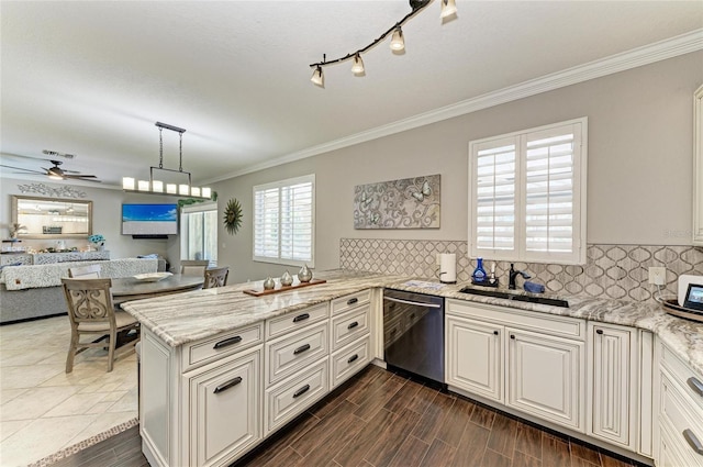 3911 91st Ave E, Parrish, FL 34219 - kitchen with dishwasher, crown molding, light stone countertops, a peninsula, and decorative backsplash