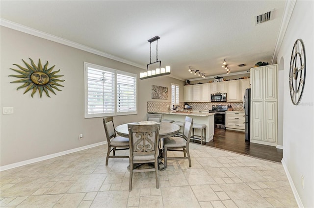 3911 91st Ave E, Parrish, FL 34219 - dining room featuring ornamental molding and baseboards