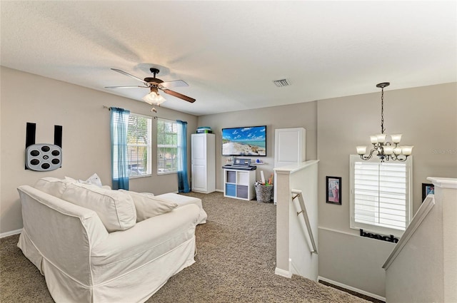 3911 91st Ave E, Parrish, FL 34219 - carpeted living room featuring a chandelier and a ceiling fan