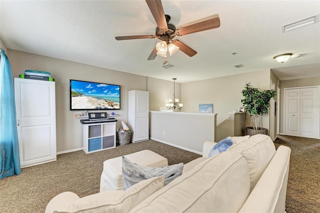 3911 91st Ave E, Parrish, FL 34219 - living room featuring carpet floors, a ceiling fan, a chandelier, and a textured ceiling