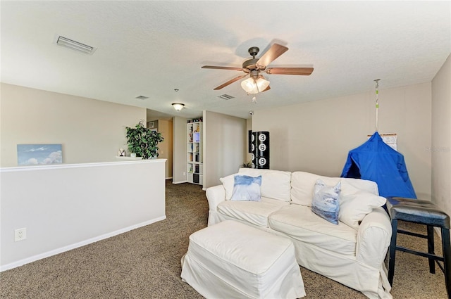 3911 91st Ave E, Parrish, FL 34219 - carpeted living area with ceiling fan and a textured ceiling
