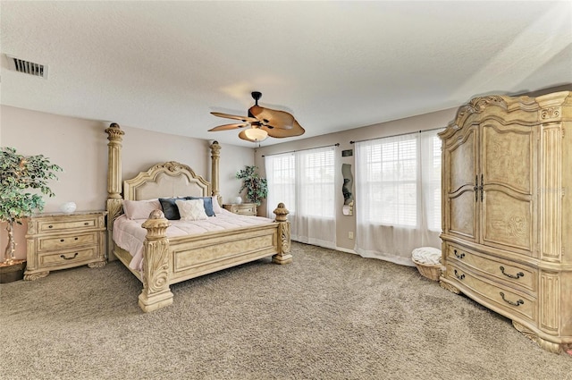 3911 91st Ave E, Parrish, FL 34219 - bedroom with light colored carpet, ceiling fan, and a textured ceiling